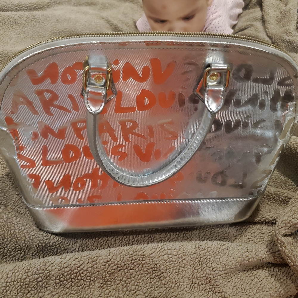 Silver Alma Purse Bought For $1K